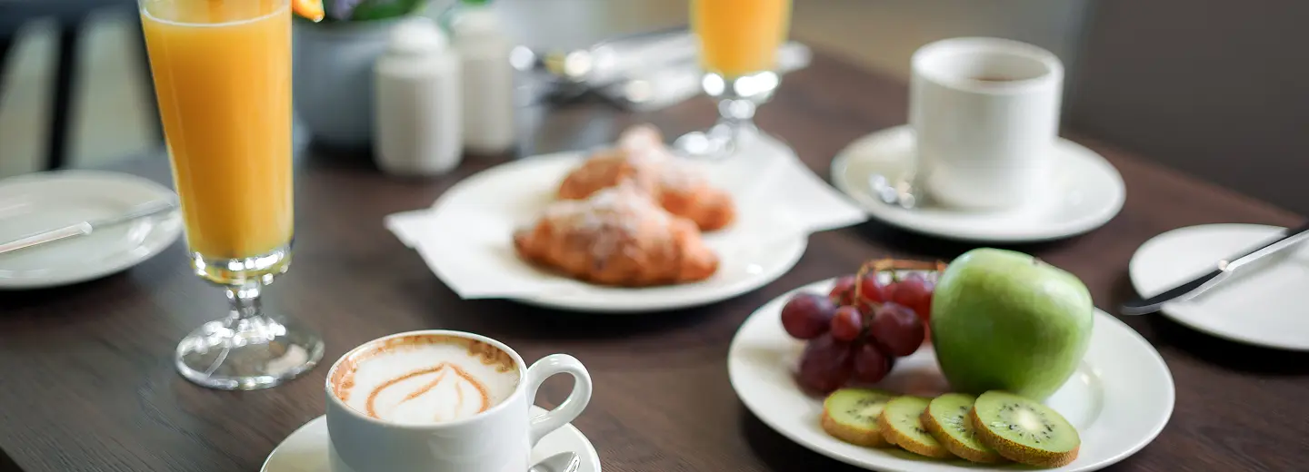 Breakfast spread with drinks and pastries