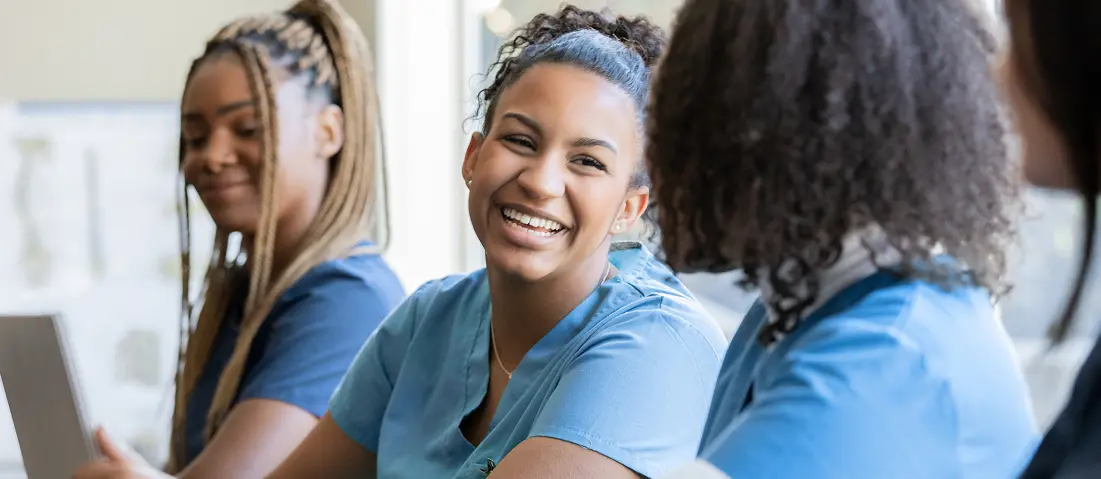 happy healthcare professionals talking with each other.
